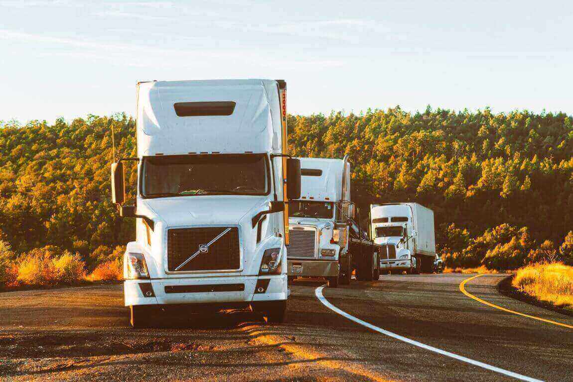 Three hotshot trucks on the road for deliver loading